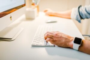A man browsing the internet for hiring a moving company.