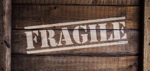 The word fragile written on a wooden crate.