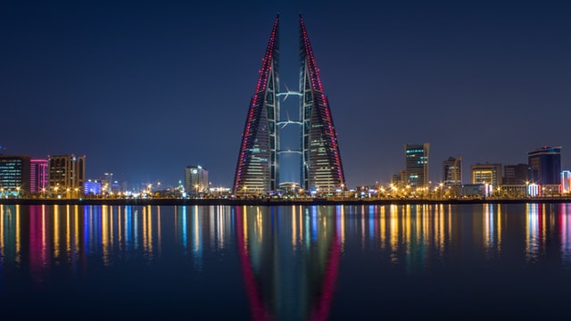 An image of buildings in the night in Bahrain, read about exporting goods to Bahrain