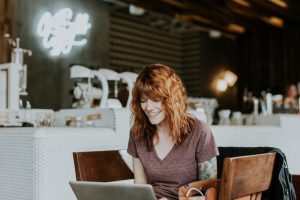 A woman searching online for the affordable housing in Manhattan.