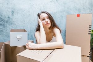 A depressed woman packing