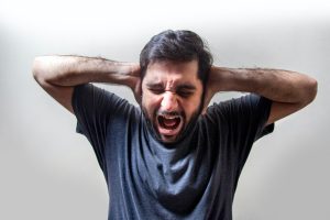 Overwhelmed person moving house is one of life's most stressful events