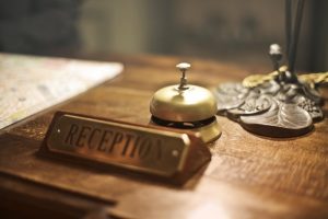 Reception desk with a bell.